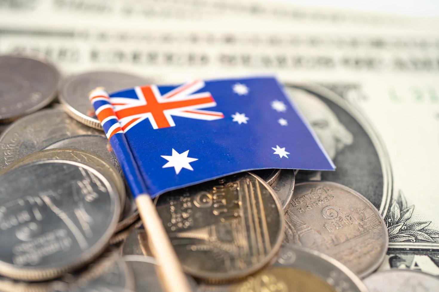 Stack of coins with Australia flag on white background. photo