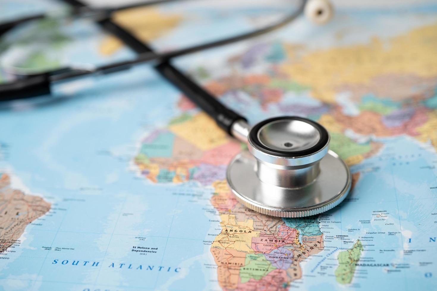 Bangkok, Thailand - June 1, 2020, Stethoscope on Africa world globe map background. photo