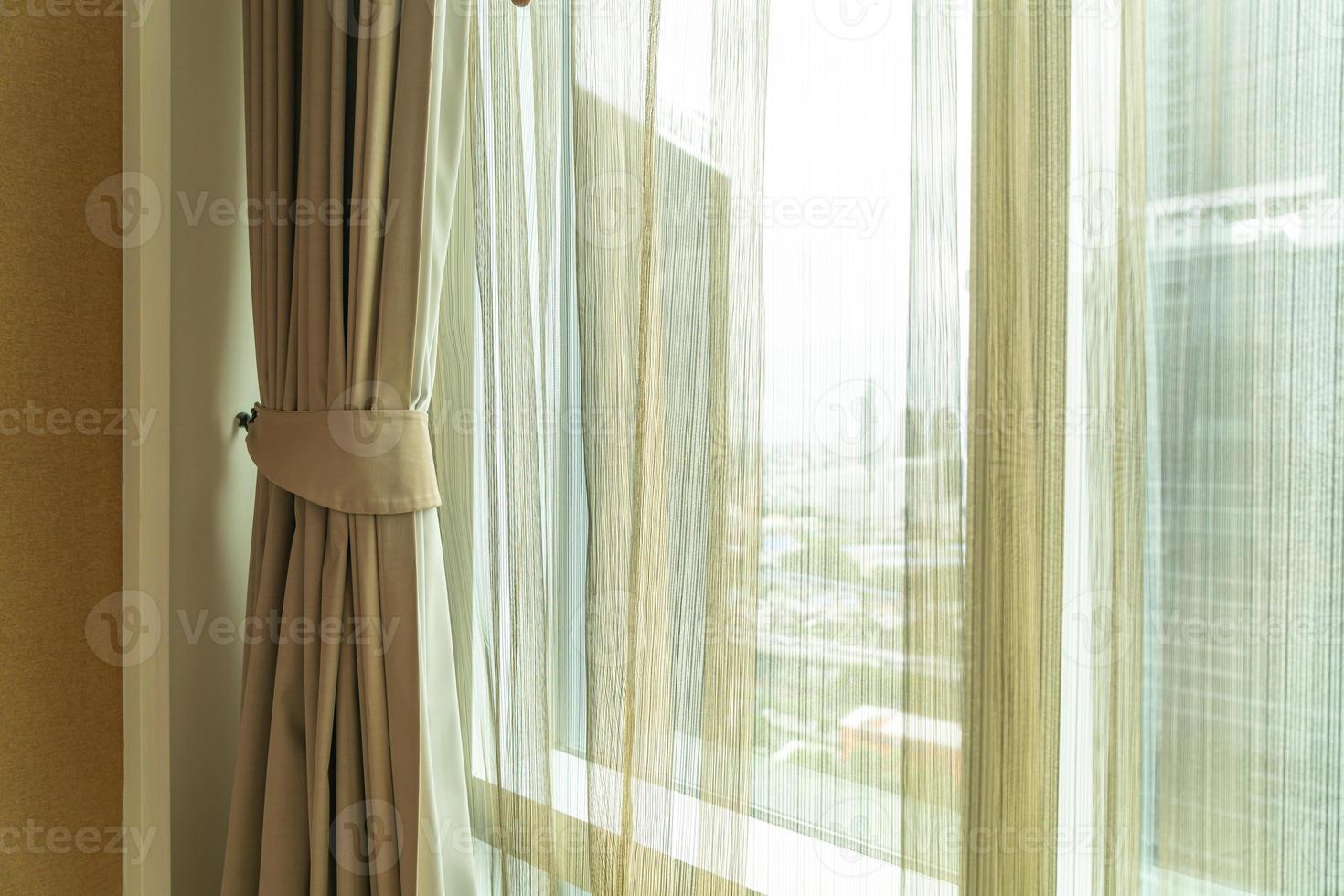 Beautiful curtain with window and sunlight photo