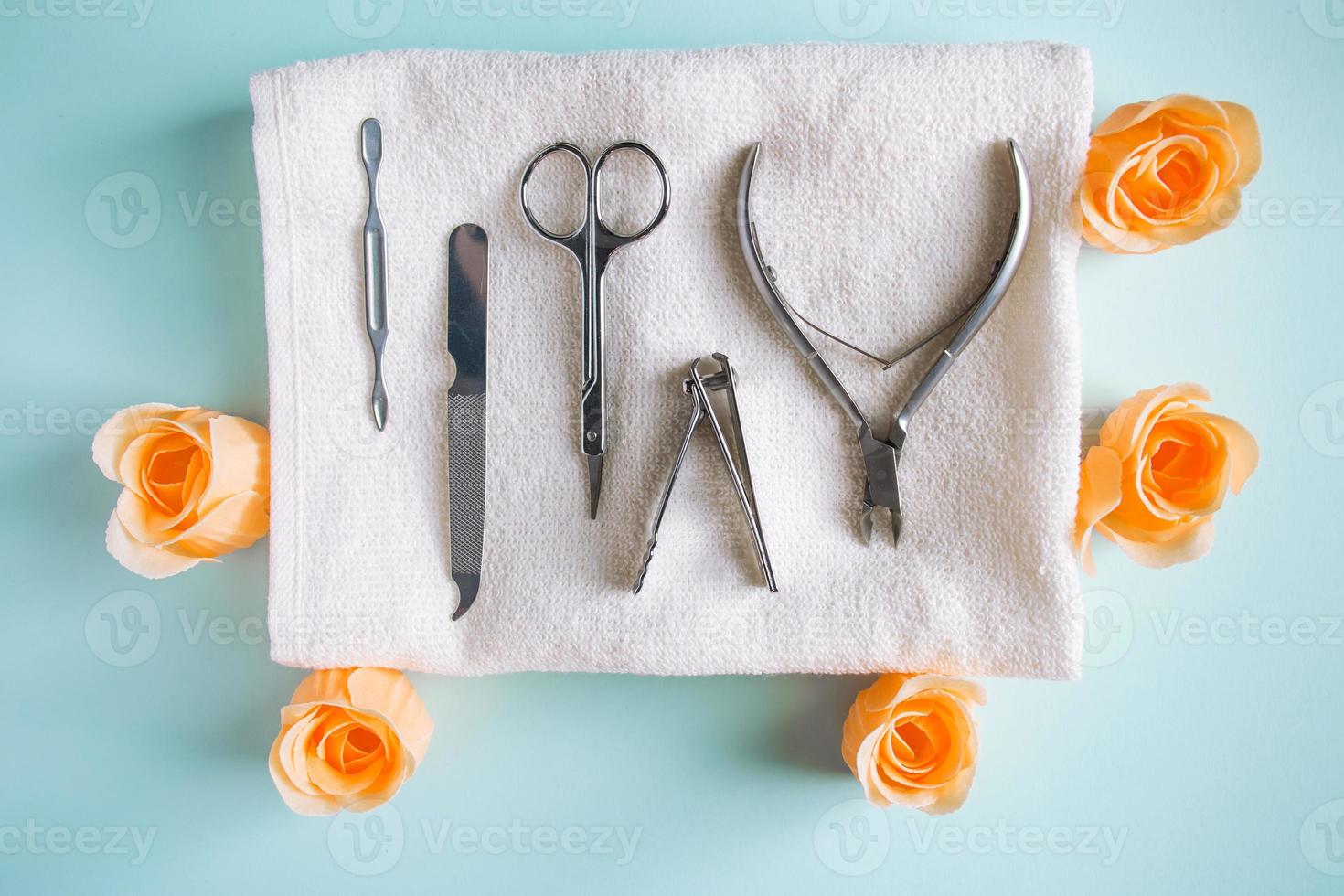 Tools for manicure and nail care on blue background. photo