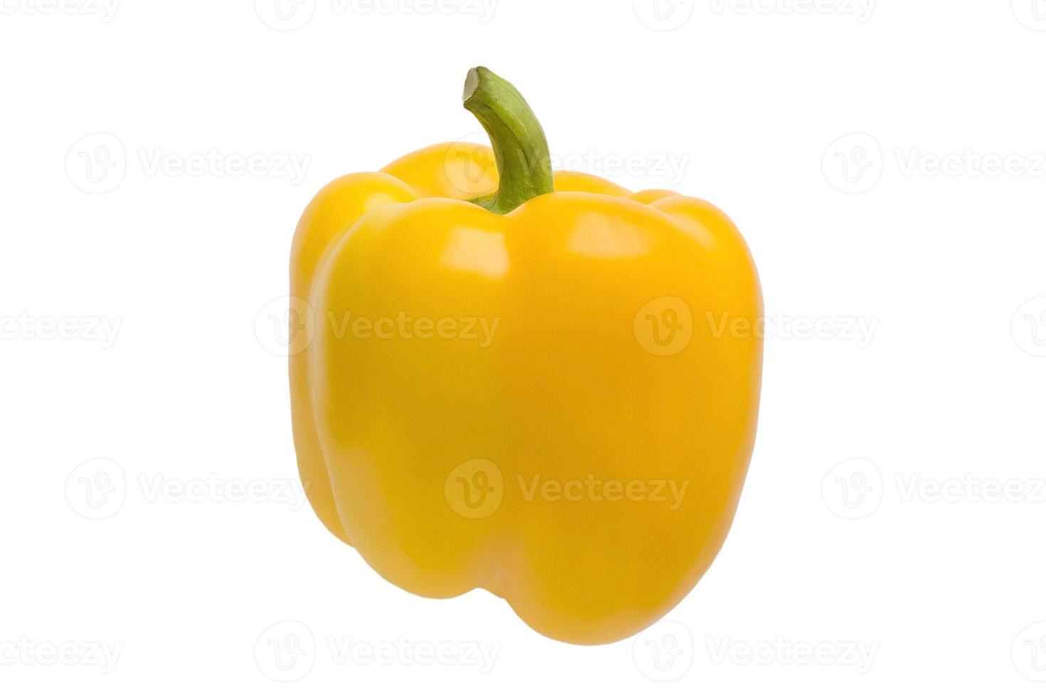 Isolated pepper. One yellow bell pepper isolated on white background photo