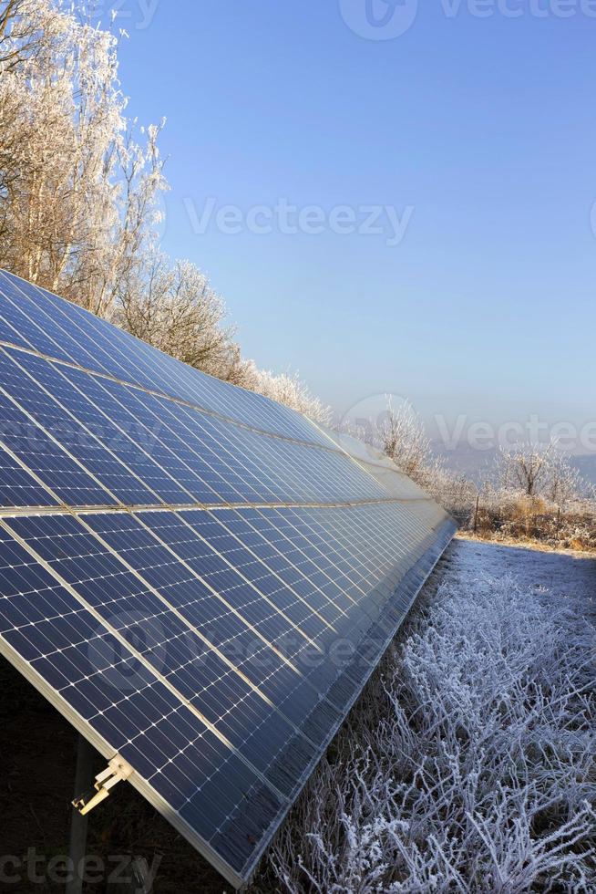 Solar Power Station in the snowy freeze winter Nature photo