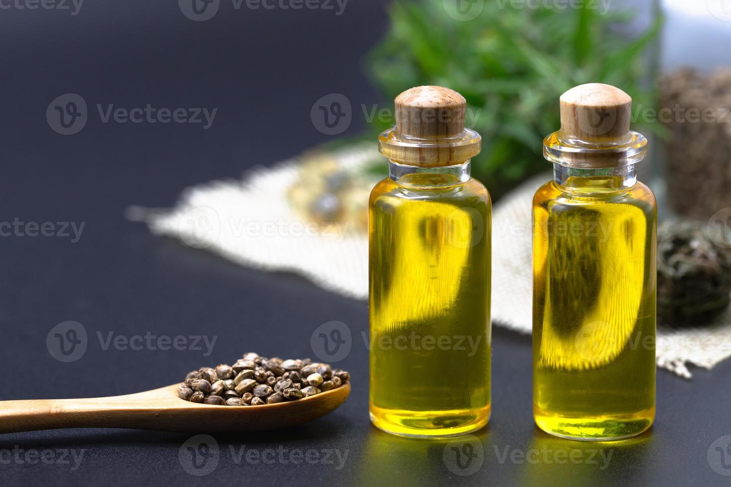 Hemp seeds and hemp oil, CBD cannabis oil extract, marijuana  alternative herbal medicine concept. photo