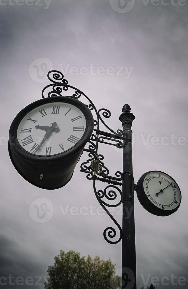 Old clock in a city photo