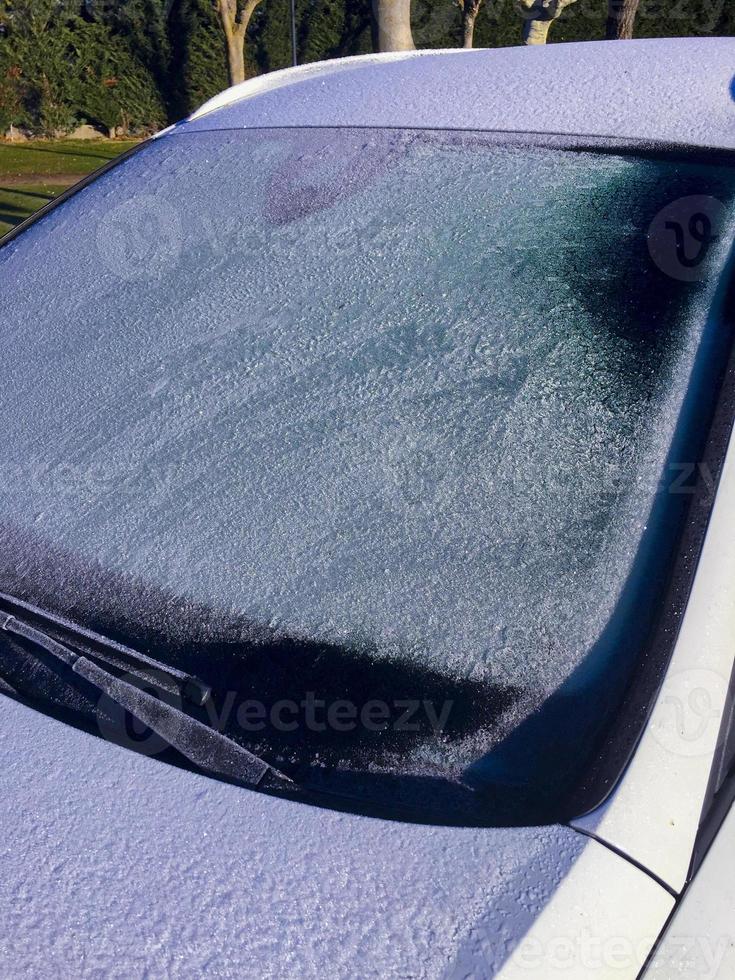 Frosted windshield of a vehicle in winter photo