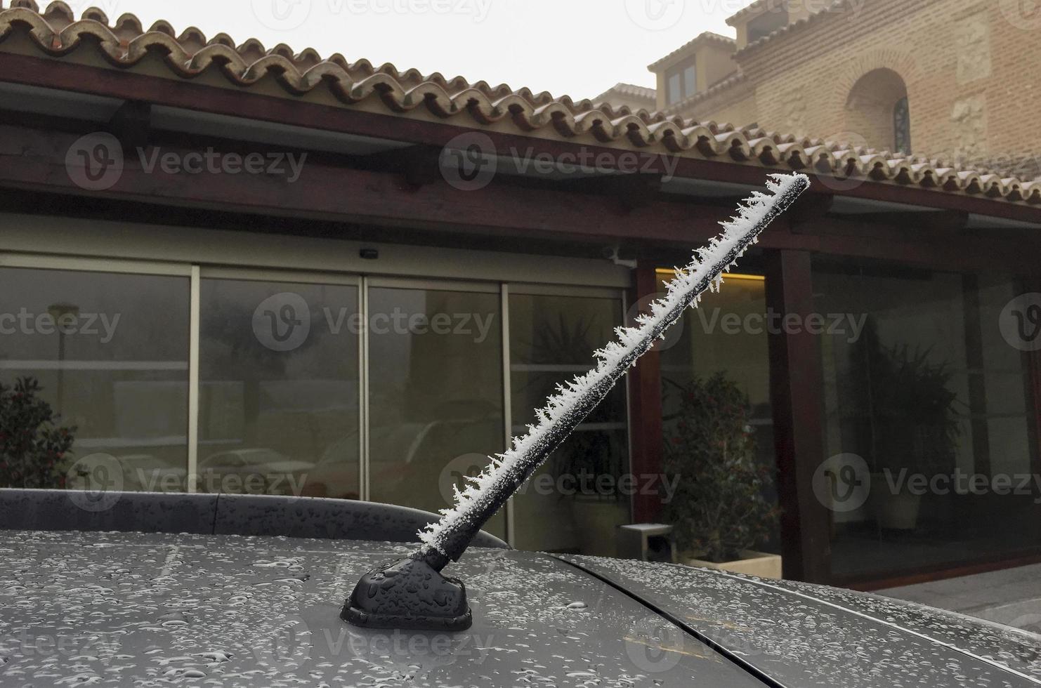 Car radio antenna frosted by the cold of winter photo