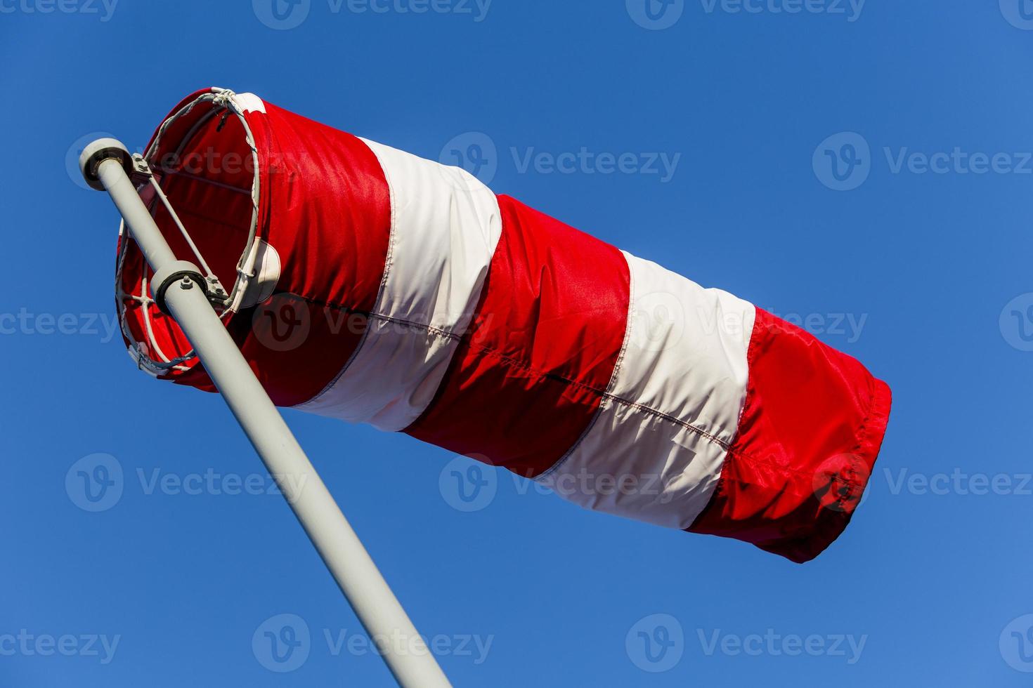 Windsock in the blue sky photo