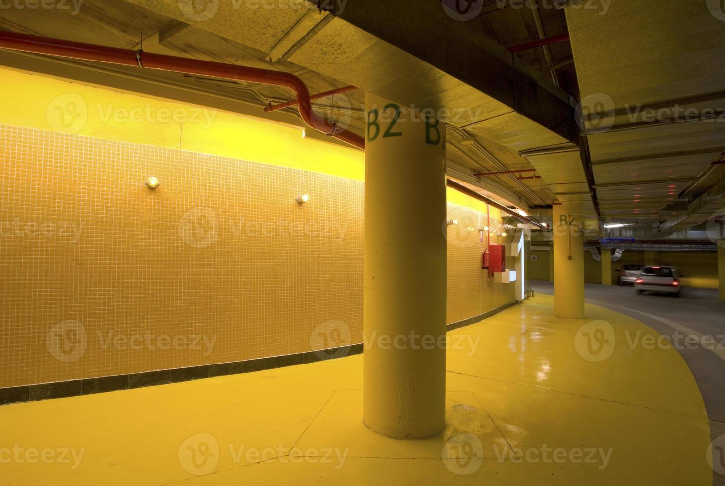 Illumination and light signaling in an underground parking of a shopping center, Spain photo