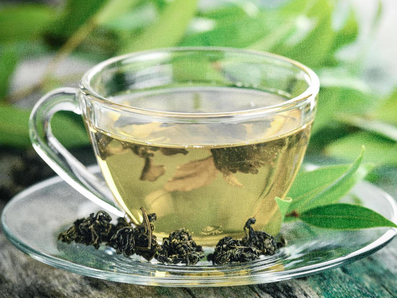 Cups of green tea on table. Photo in retro style