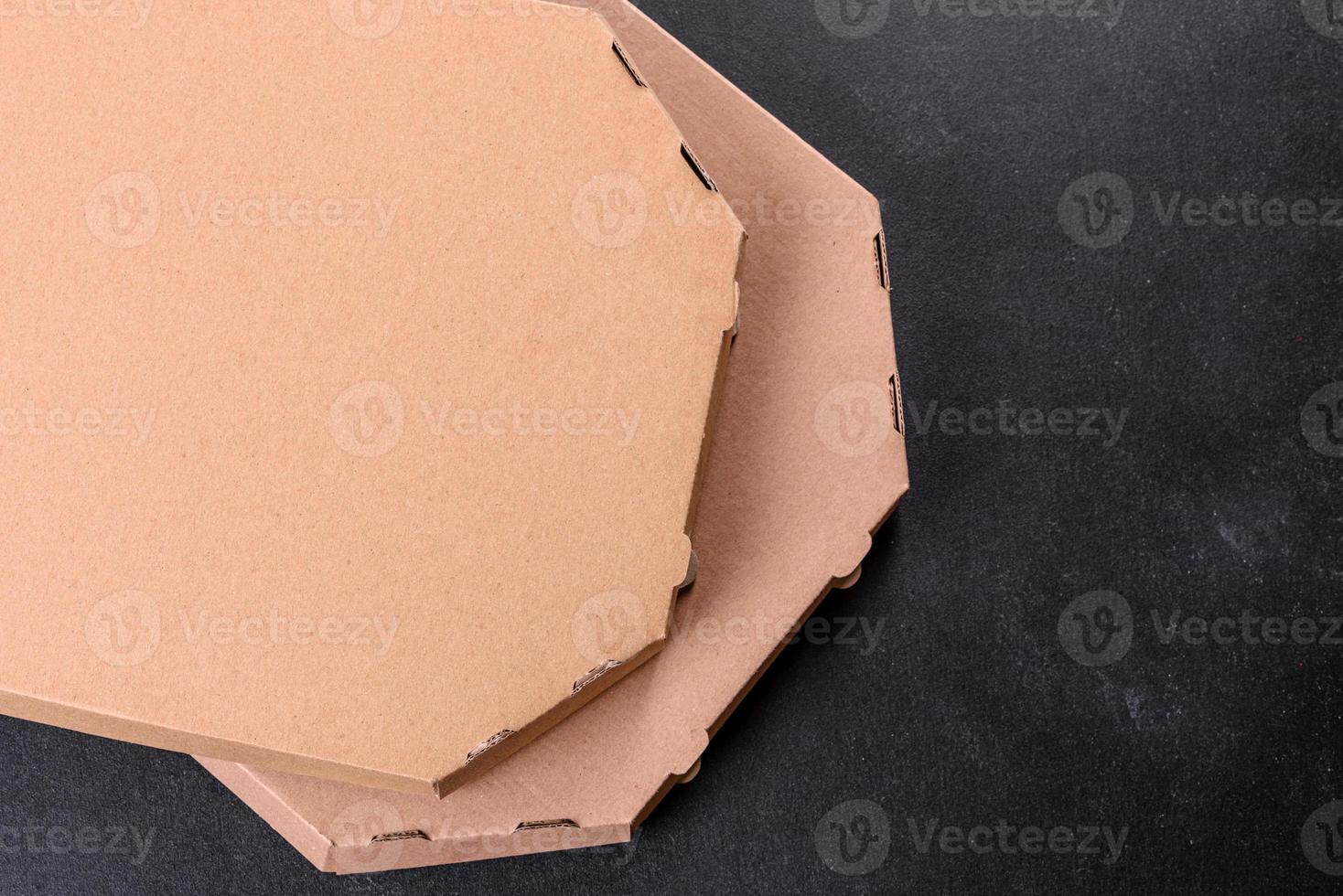 Cardboard brown box of square shape for transportation and delivery of pizza photo