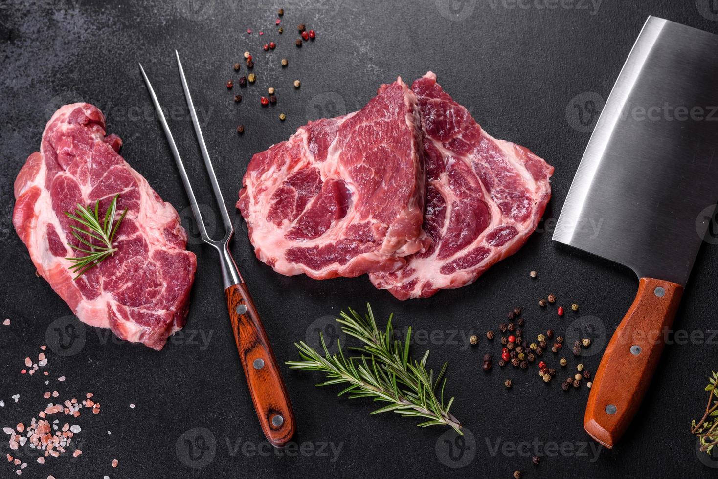 Fresh raw beef meat to make delicious juicy steak with spices and herbs photo