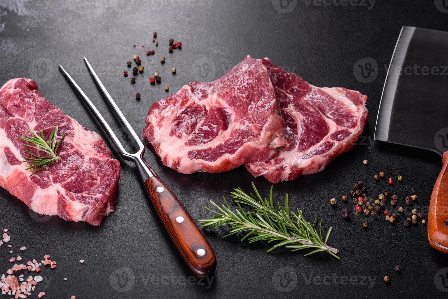 Fresh raw beef meat to make delicious juicy steak with spices and herbs photo