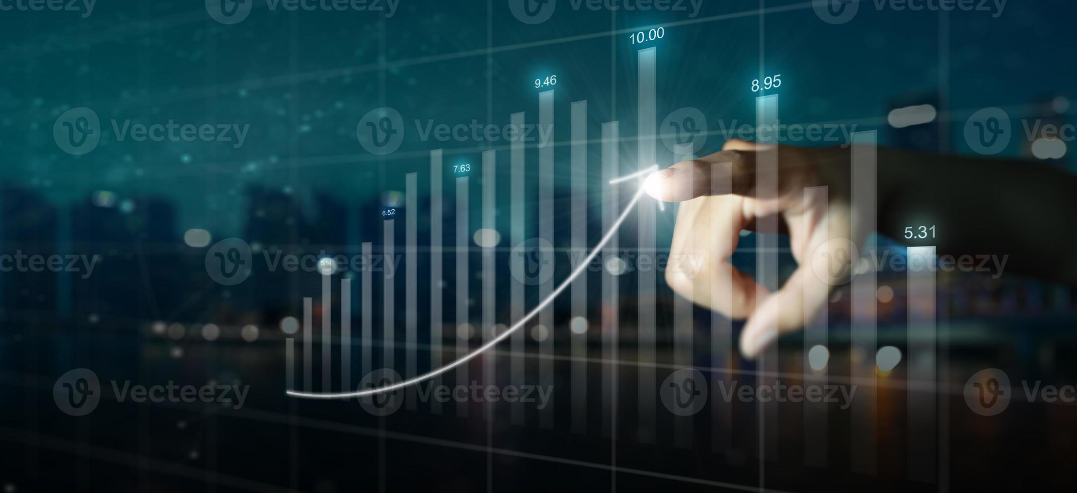 Double exposure of business mans hand pointing to arrow graph and chart photo
