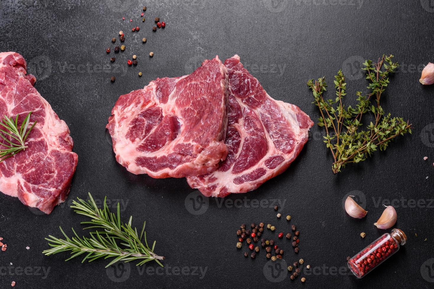 Fresh raw beef meat to make delicious juicy steak with spices and herbs photo