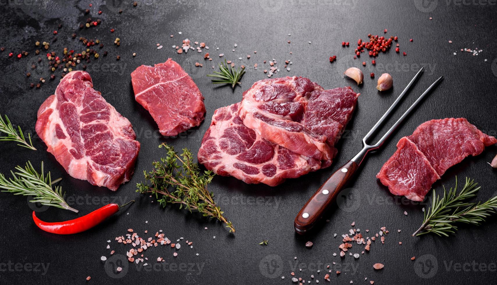 Fresh raw beef meat to make delicious juicy steak with spices and herbs photo