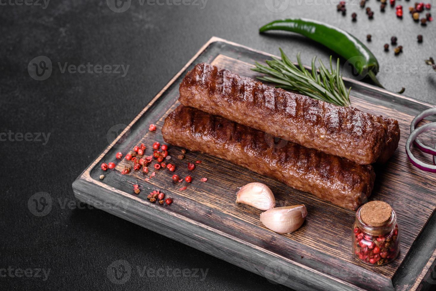 Fresh tasty kebab grilled with spices and herbs photo