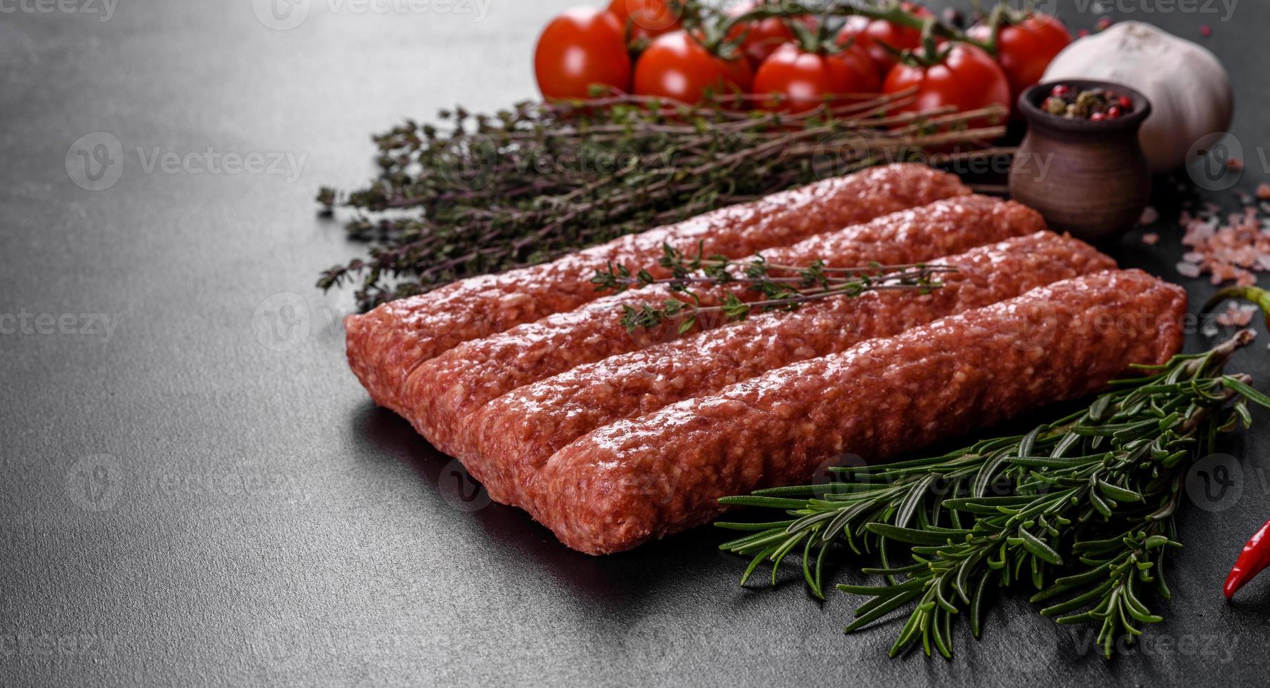 Fresh raw mince for grilled kebab with spices and herbs photo