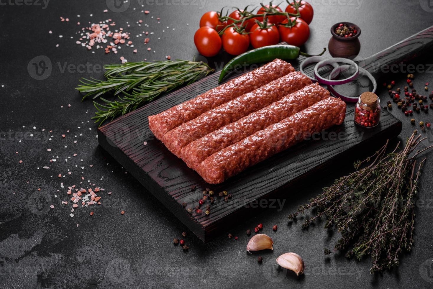 Fresh raw mince for grilled kebab with spices and herbs photo