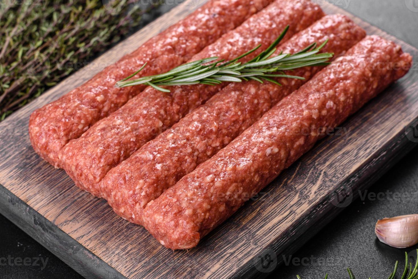Fresh raw mince for grilled kebab with spices and herbs photo