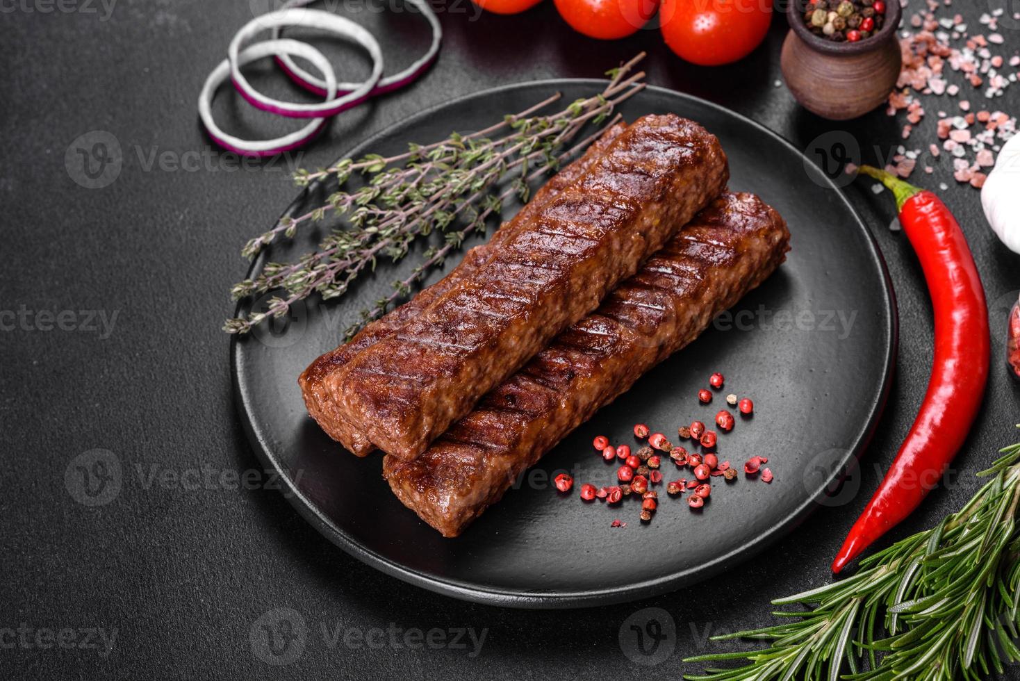 Fresh tasty kebab grilled with spices and herbs photo