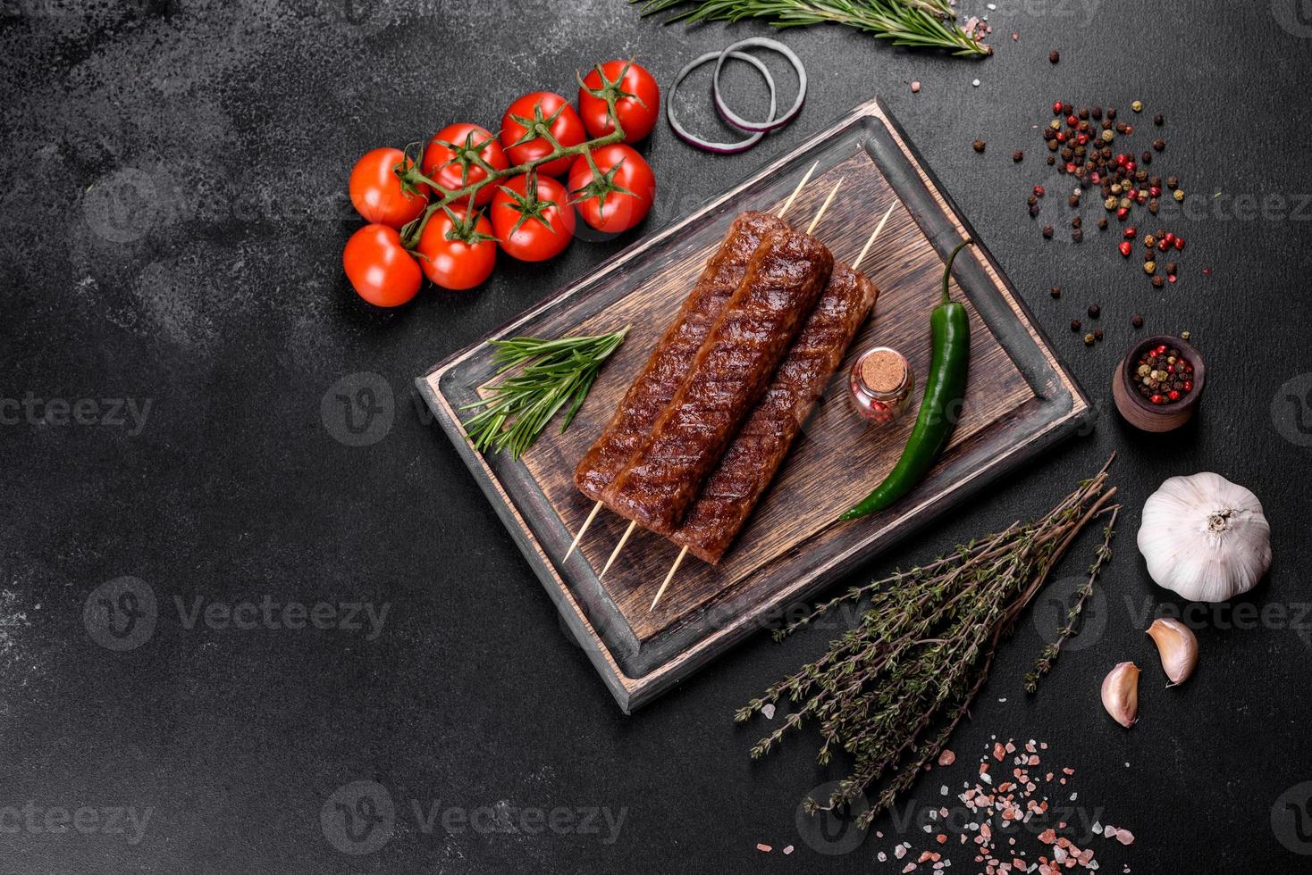 Fresh tasty kebab grilled with spices and herbs photo