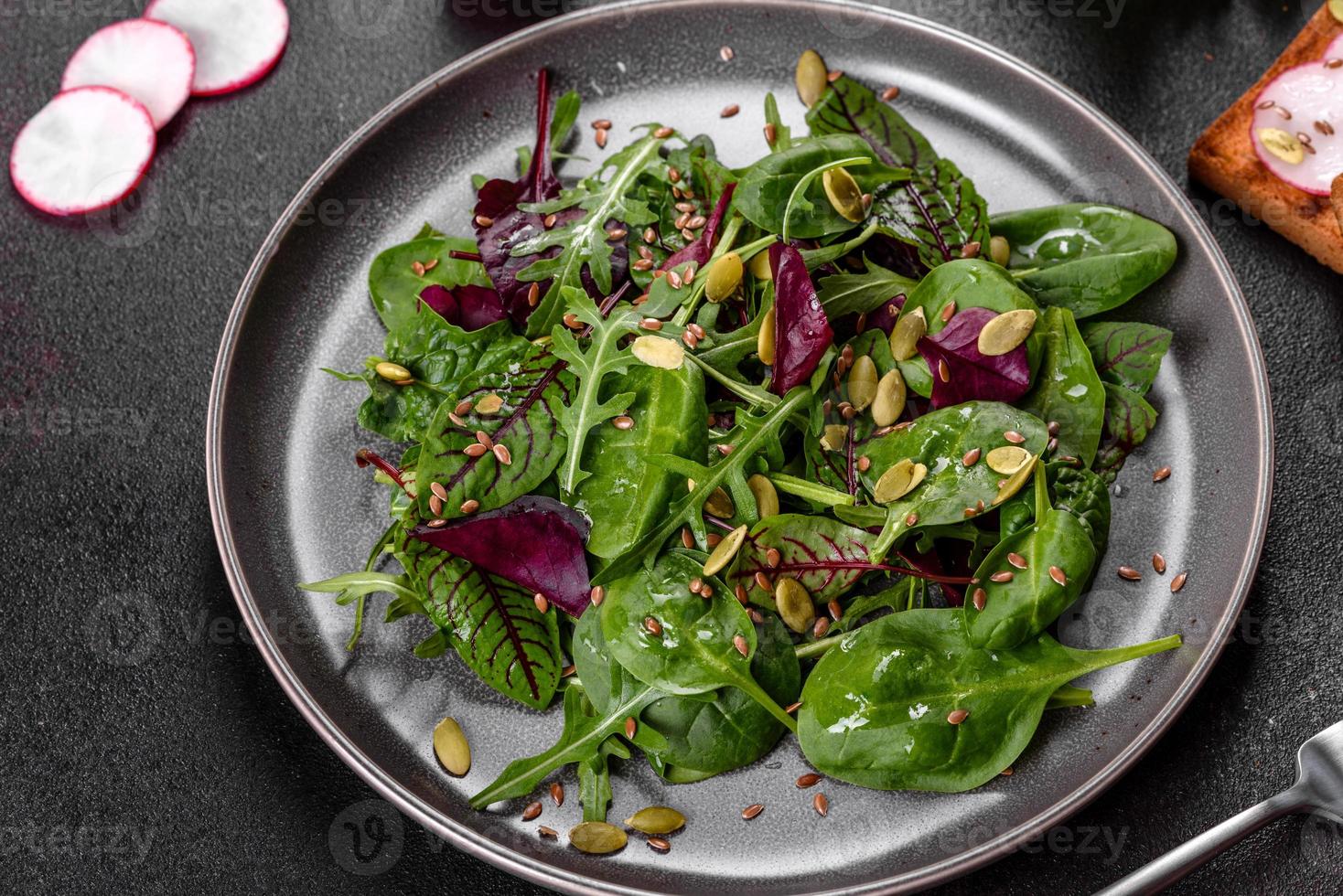 Fresh juicy salad with leaves of mangold, arugula, spinach and beets photo