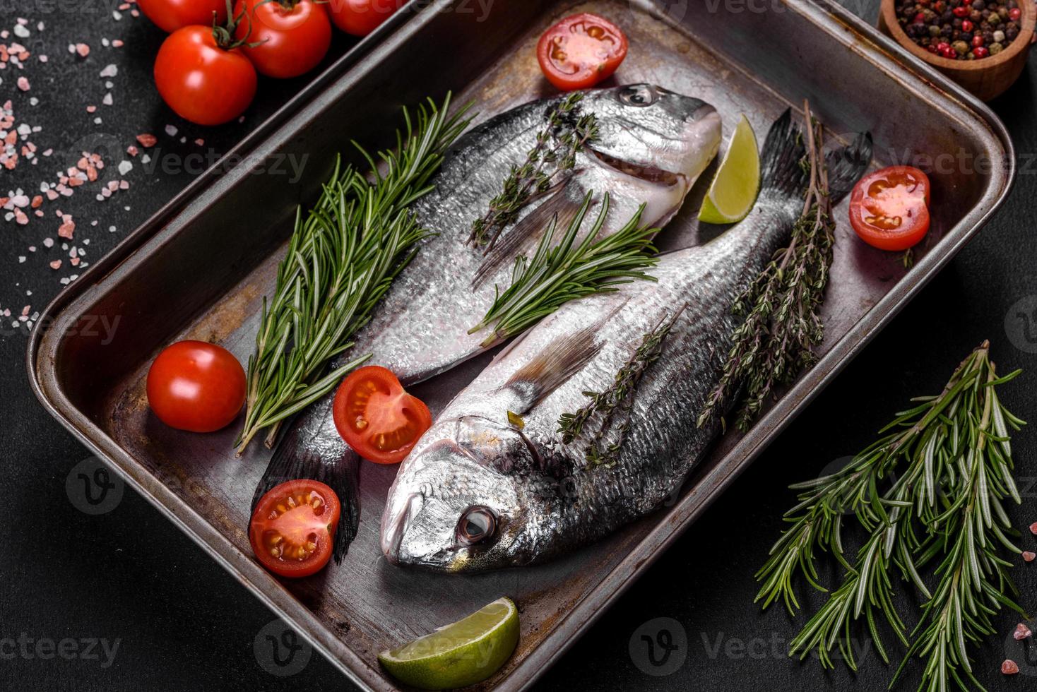 Raw dorado fish with spices cooking on cutting board. Fresh fish dorado photo