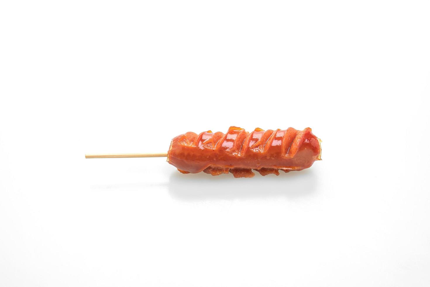 Fried sausage skewer isolated on white background photo