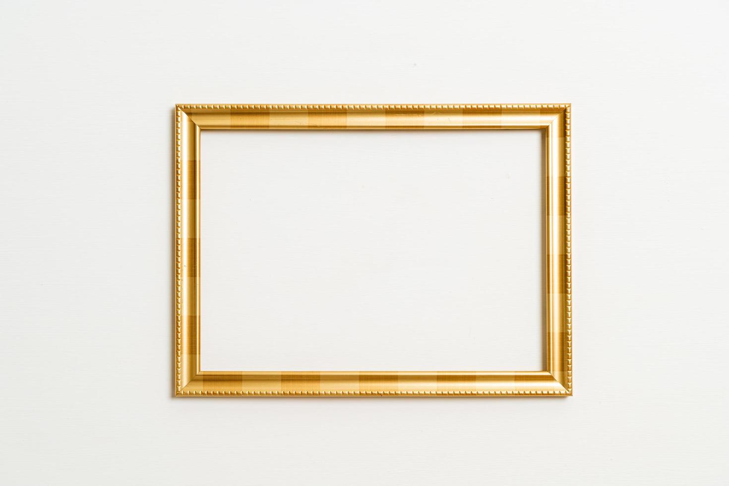 Empty picture frame on white wall background with copy space photo