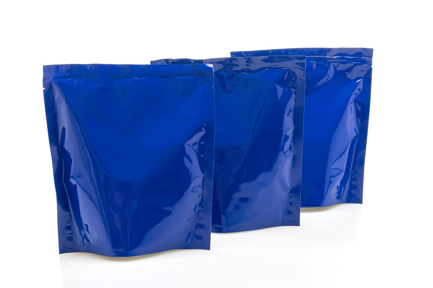 Blue plastic bag for packaging isolated on white background photo