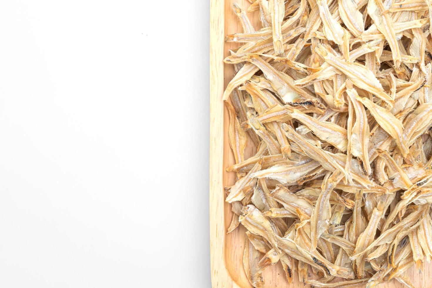 Dried small crispy bake fish isolated on white background photo