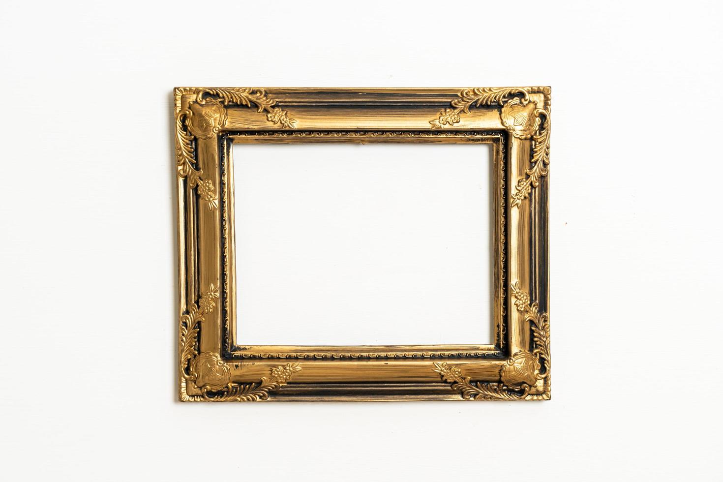 Empty picture frame on white wall background with copy space photo