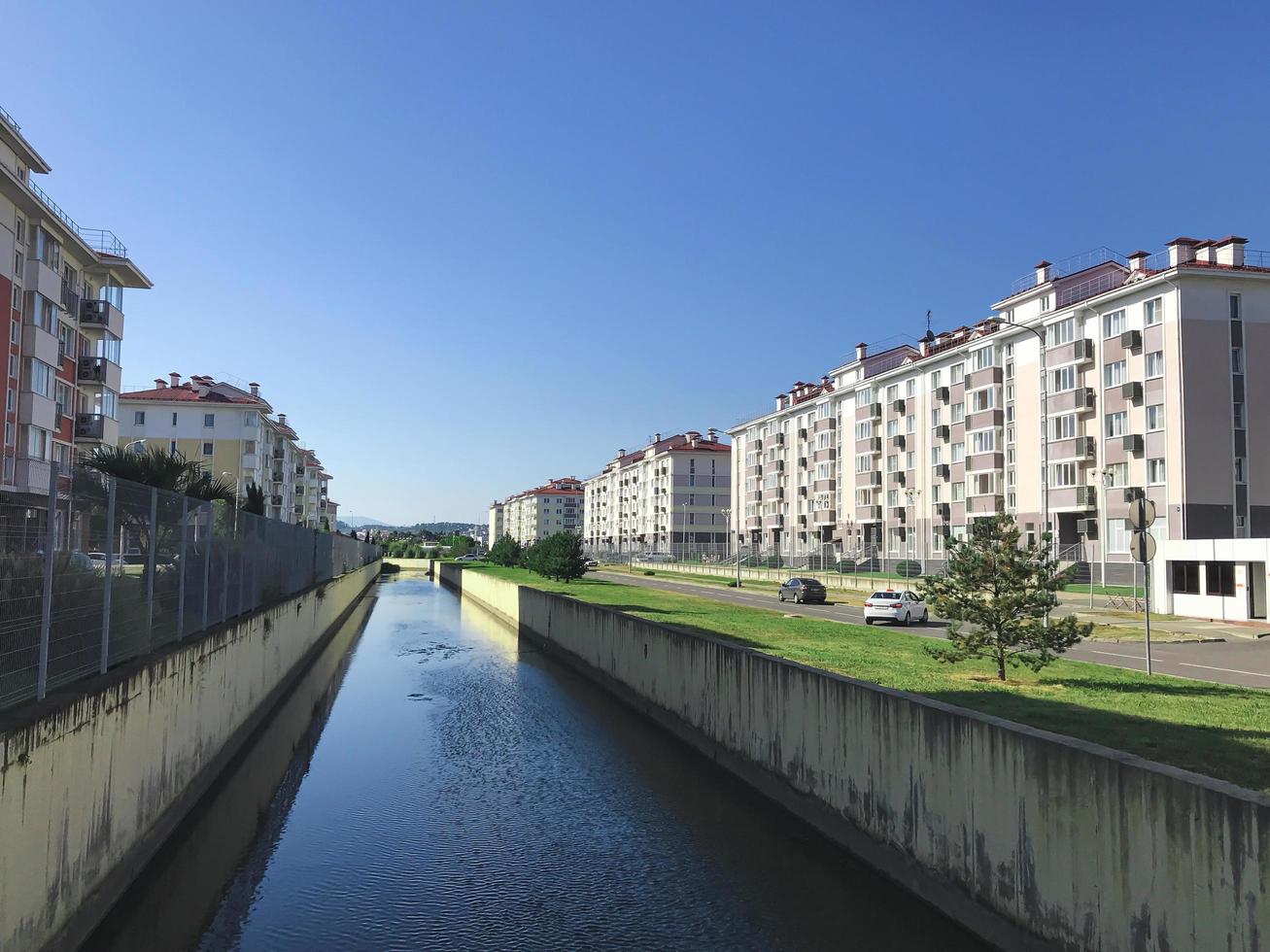 Small river in sleeping quarters of Adler city, Russia photo