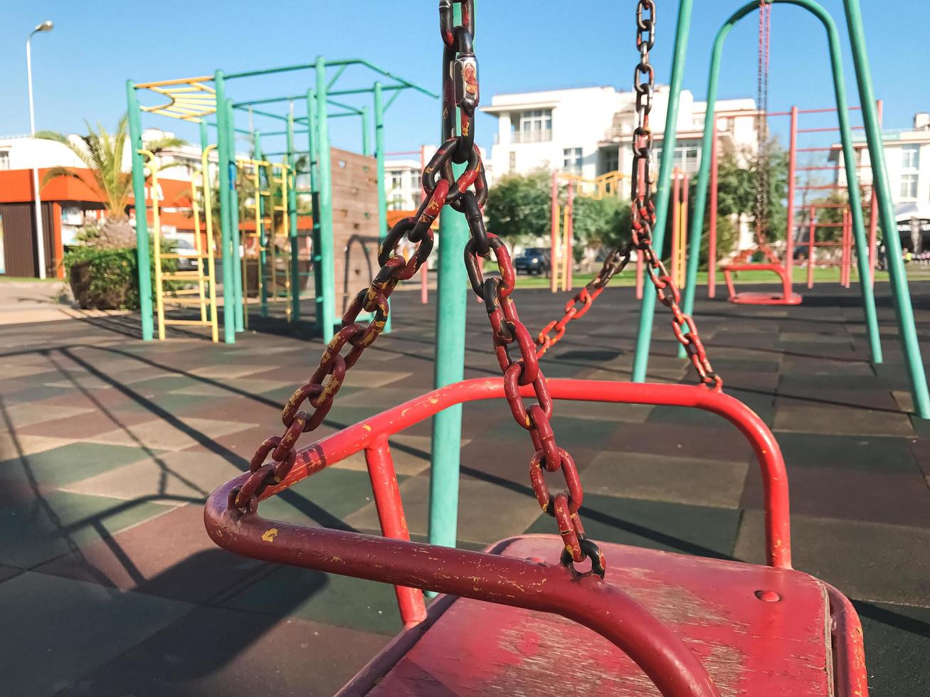 Swings on outdoor playground. Close up. Adler city, Russia photo