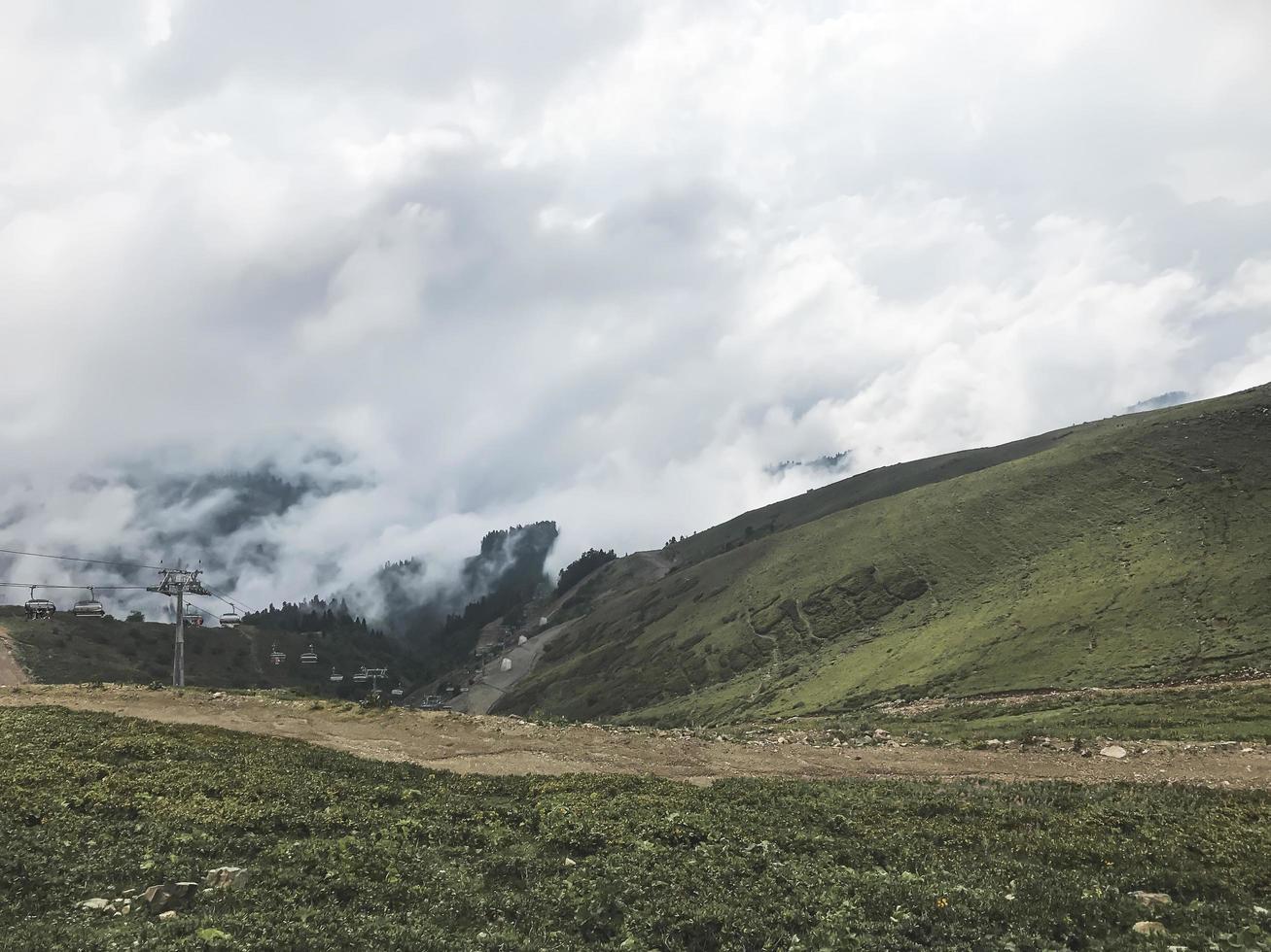Caucasus mountains wrappednin clouds. Roza Khutor, Russia photo