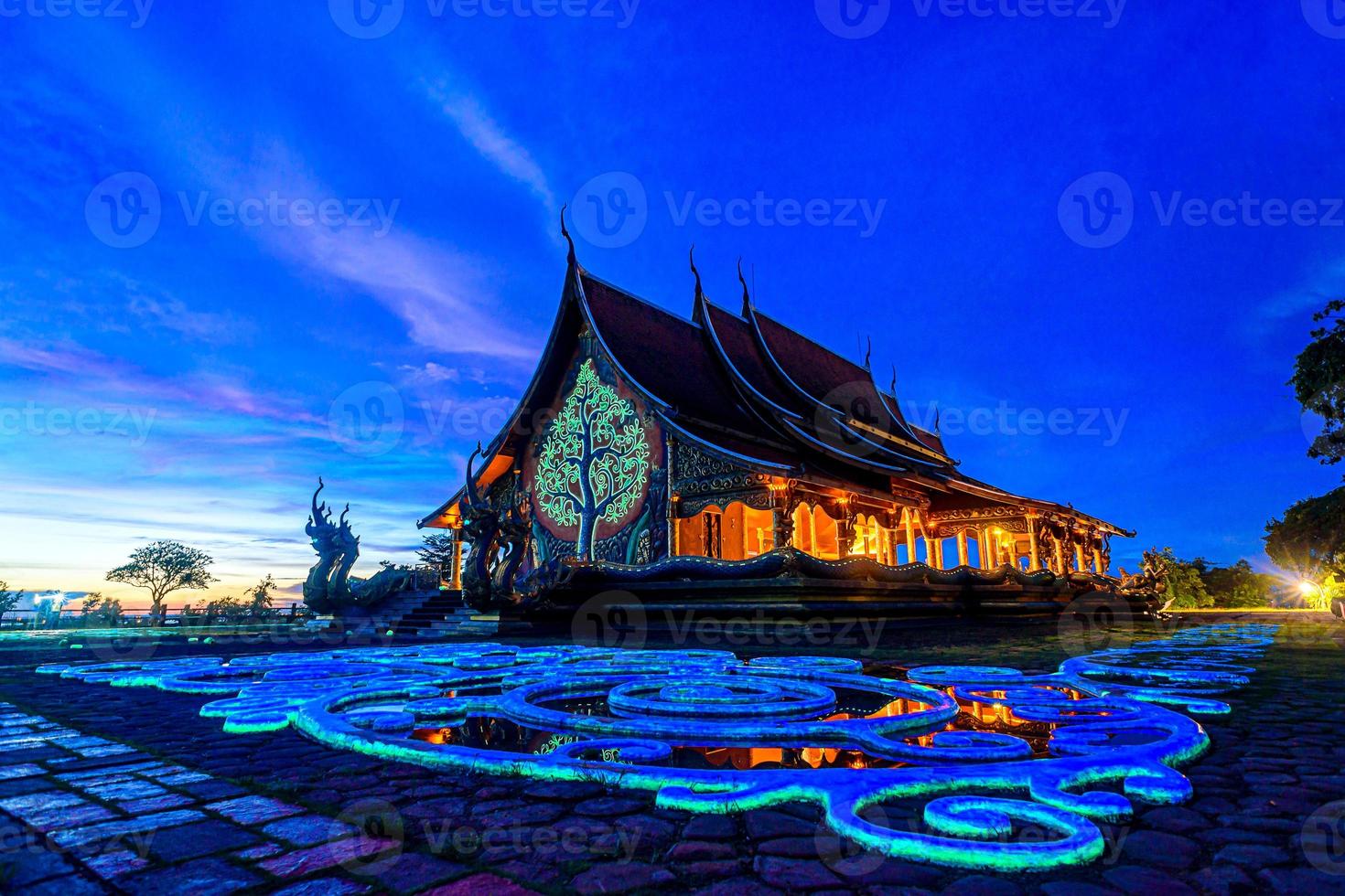 Twilight shot of Sirindhorn Wararam Phu Prao Temple in Ubonrachatani, Thailand photo