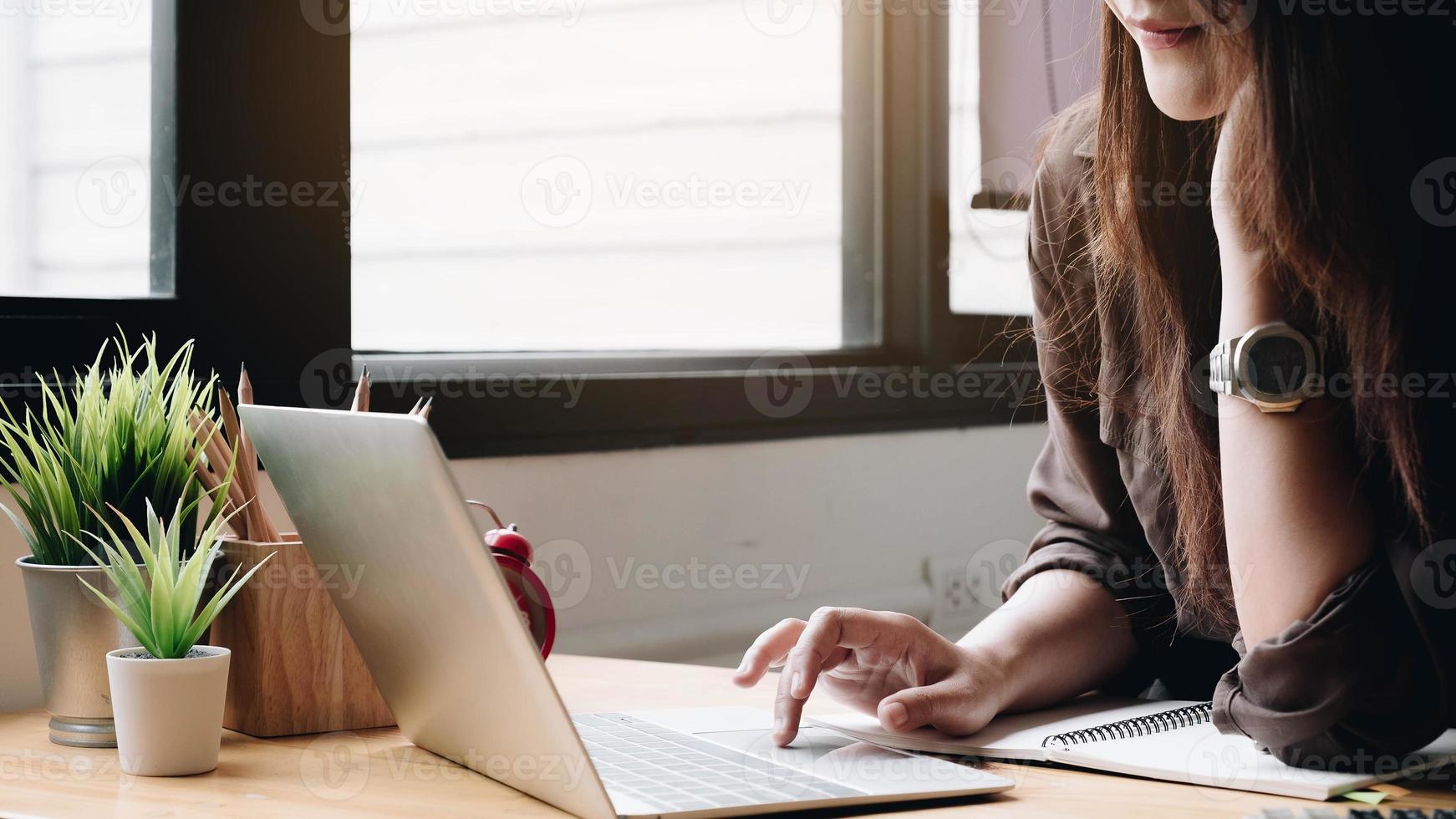 Business woman using laptop computer photo