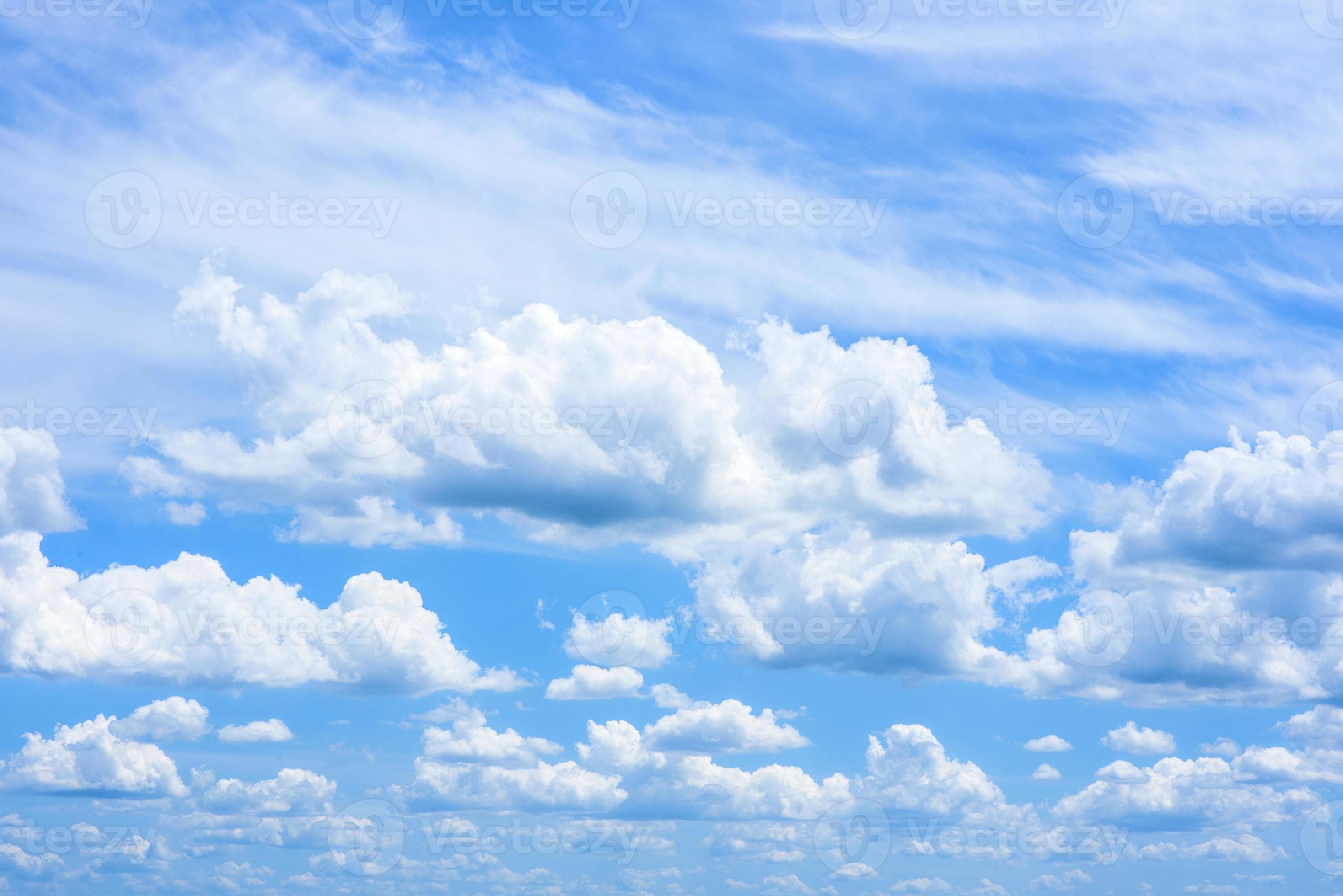 Beautiful white clouds in a bright blue sky on a warm summer day
