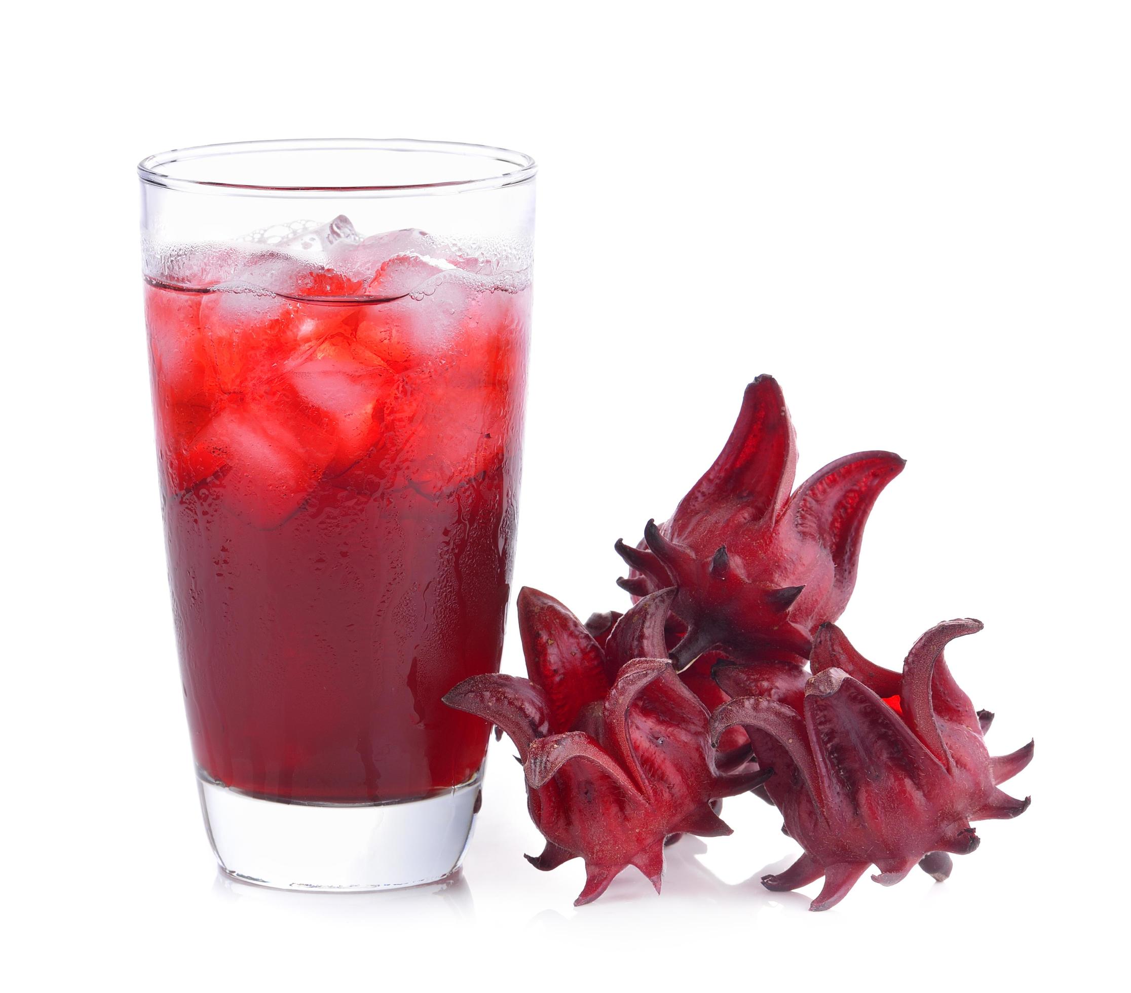 Roselle flower juice in glass with ice isolated on white background