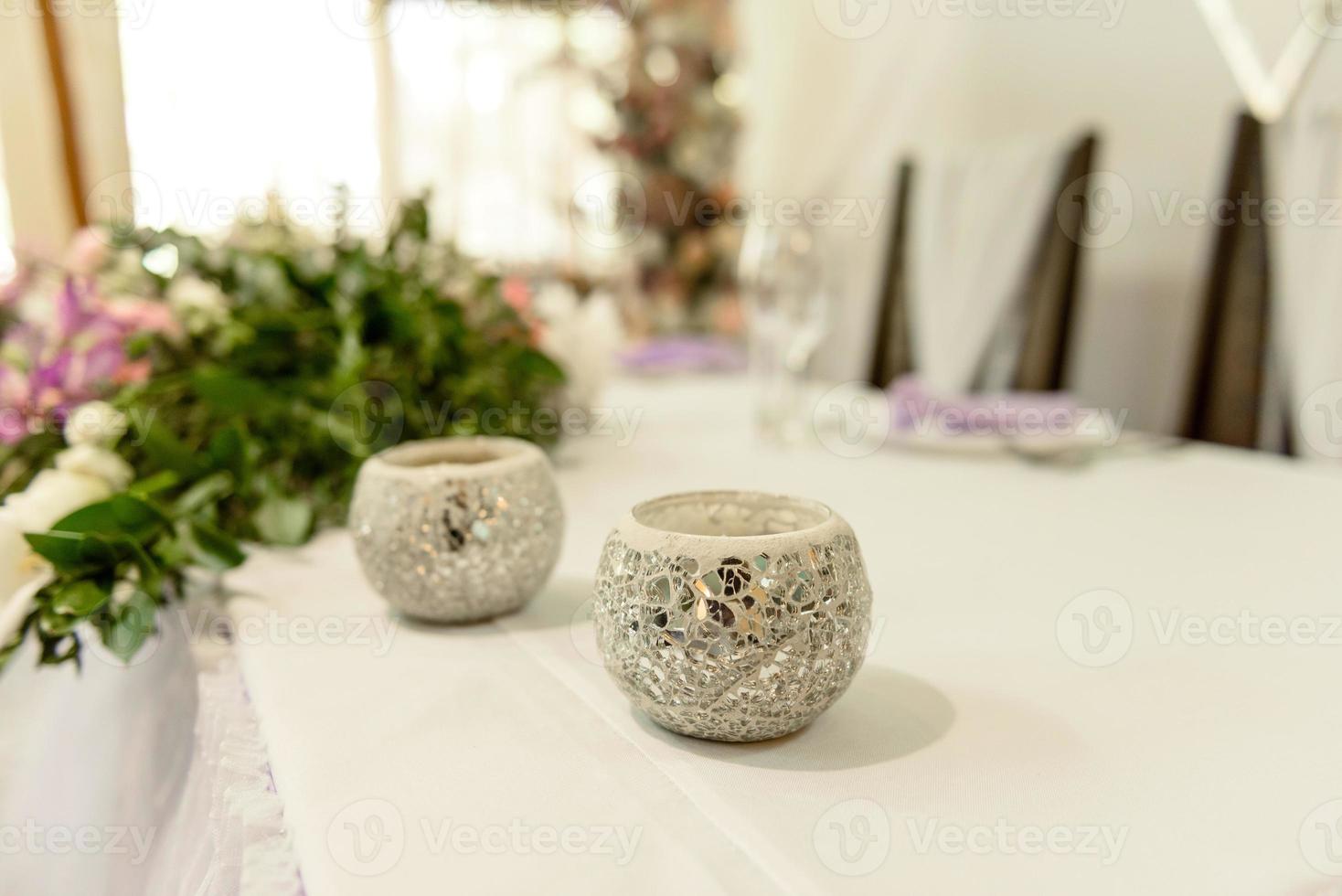 Beautiful floral compositions in the restaurant for the wedding ceremony photo