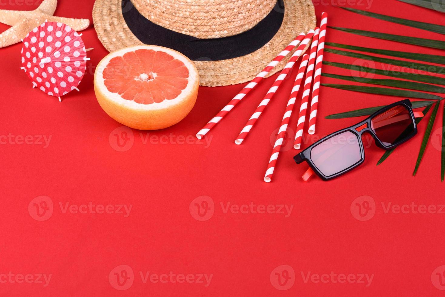 Beach accessories with shells and sea stars on a colored background photo