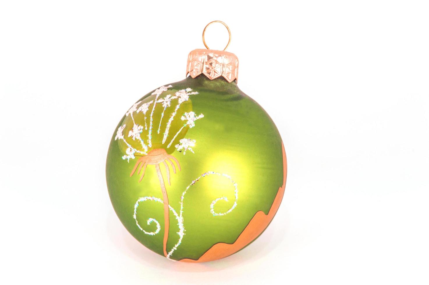 Green Christmas ball isolated on white background photo