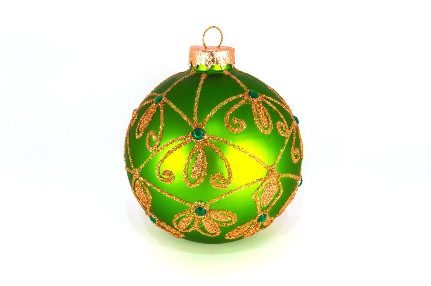 Green Christmas ball isolated on white background photo