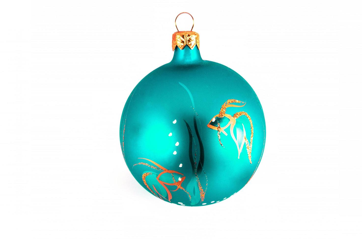 Turquoise Christmas ball isolated on white background photo