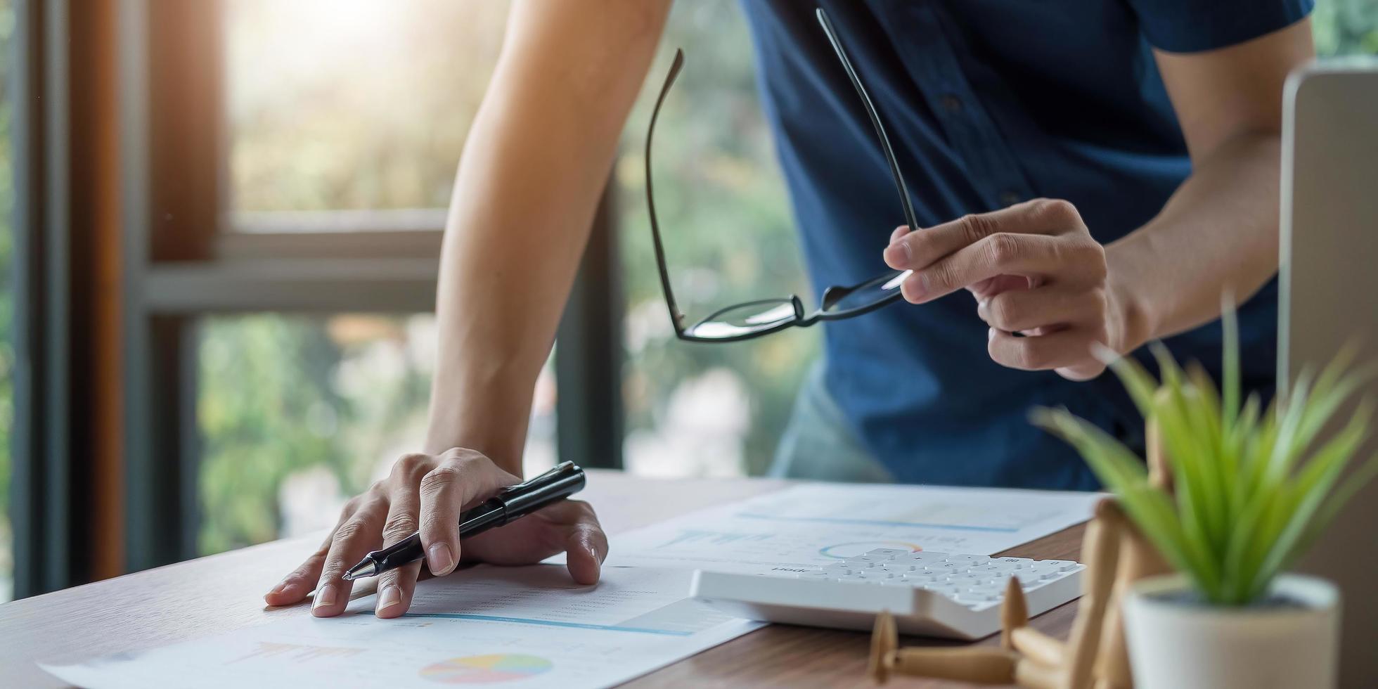 Businessman using a pen photo