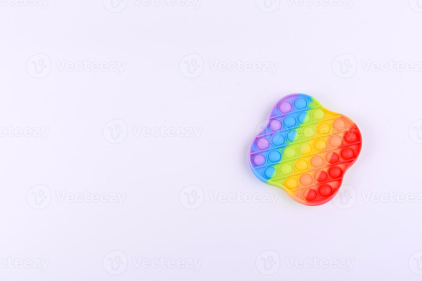 Bright colorful children's toy made of silicone designed to relieve stress photo