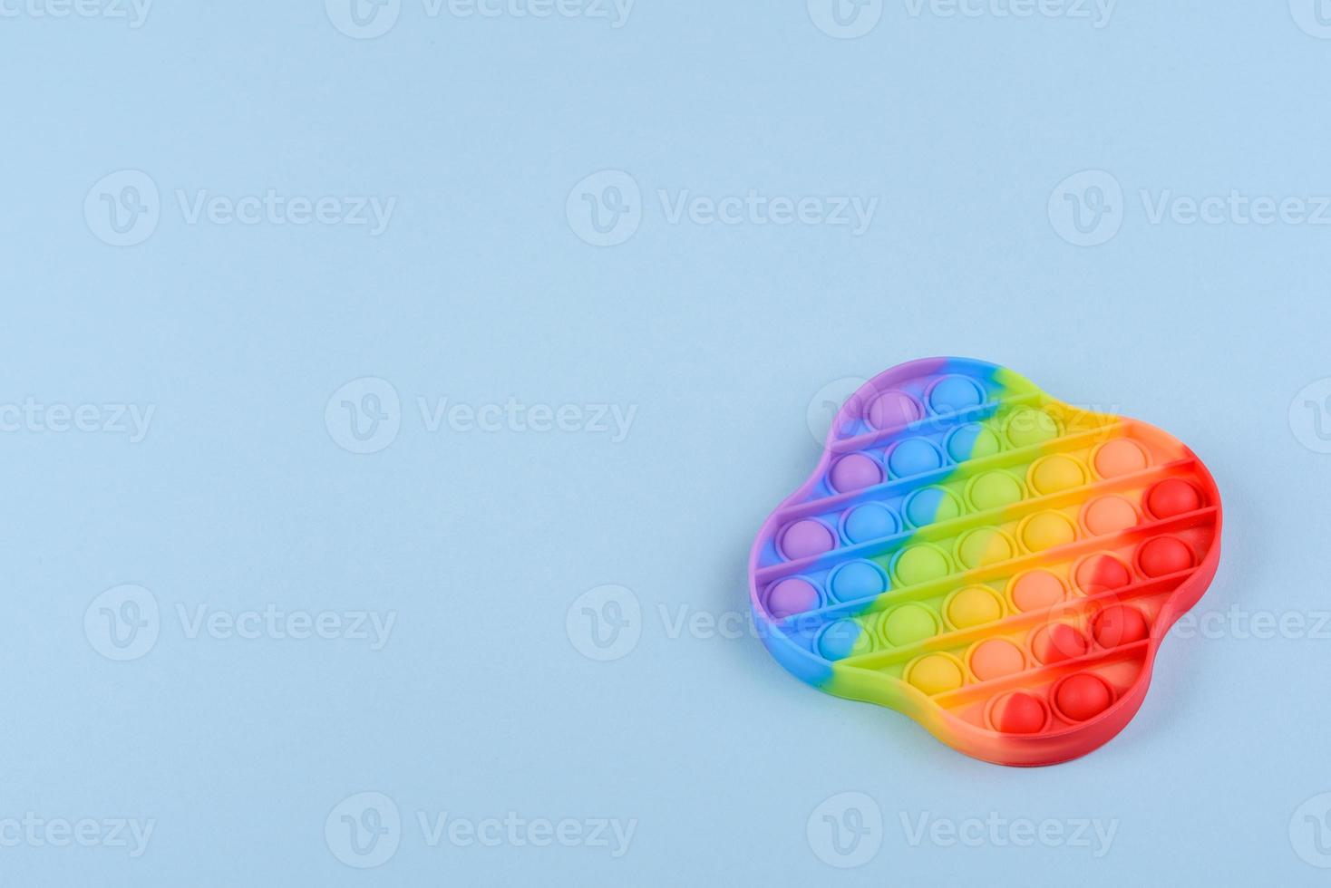 Bright colorful children's toy made of silicone designed to relieve stress photo