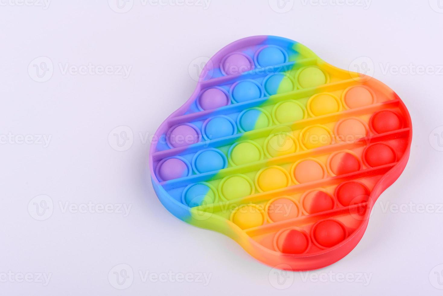 Bright colorful children's toy made of silicone designed to relieve stress photo