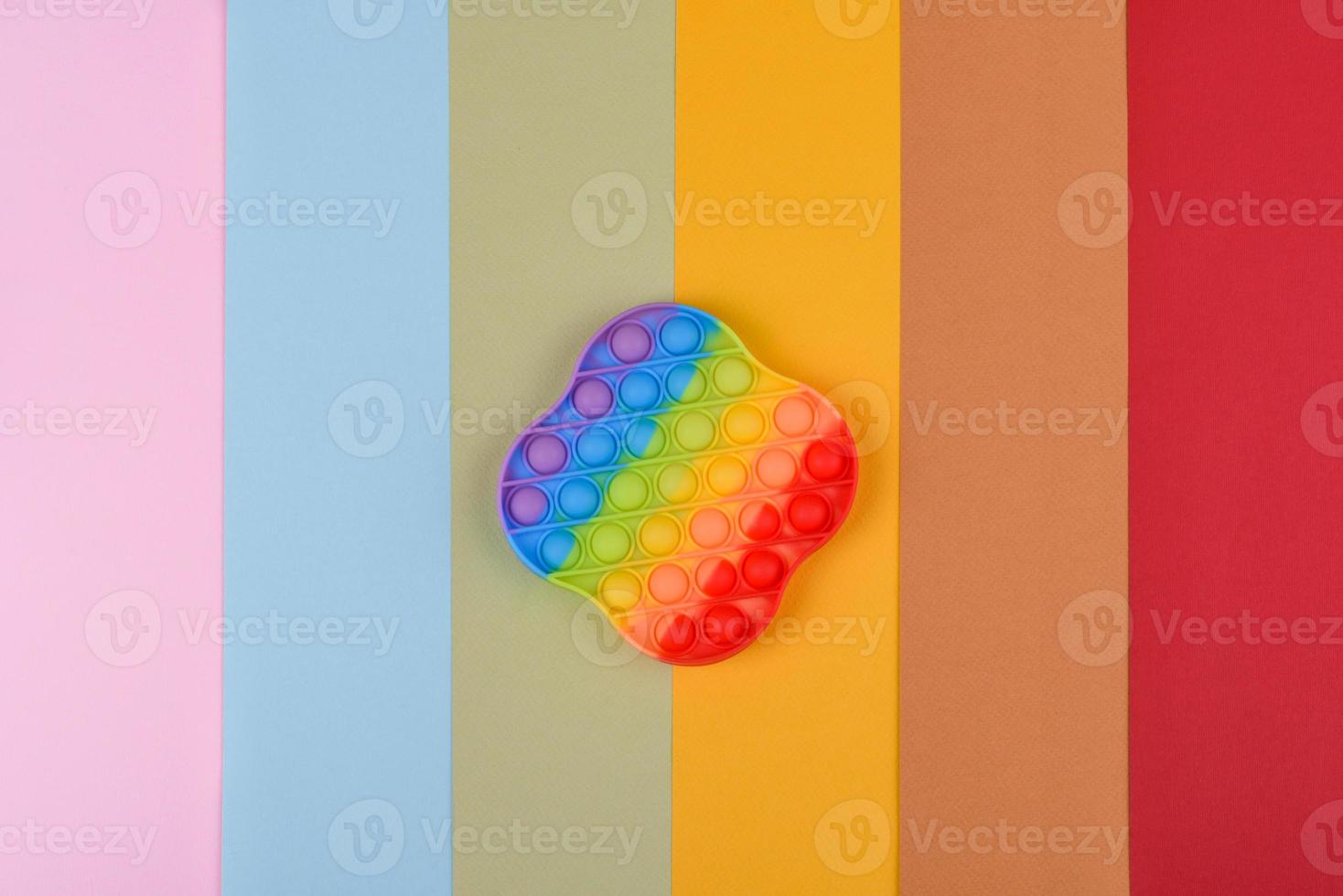 Bright colorful children's toy made of silicone designed to relieve stress photo