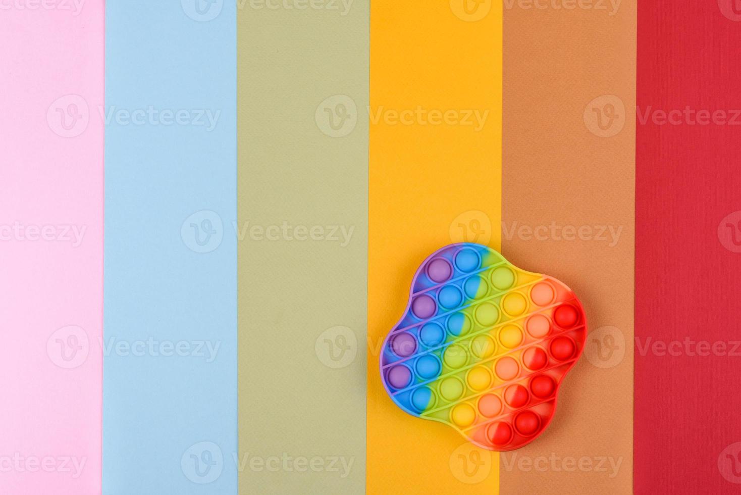 Bright colorful children's toy made of silicone designed to relieve stress photo